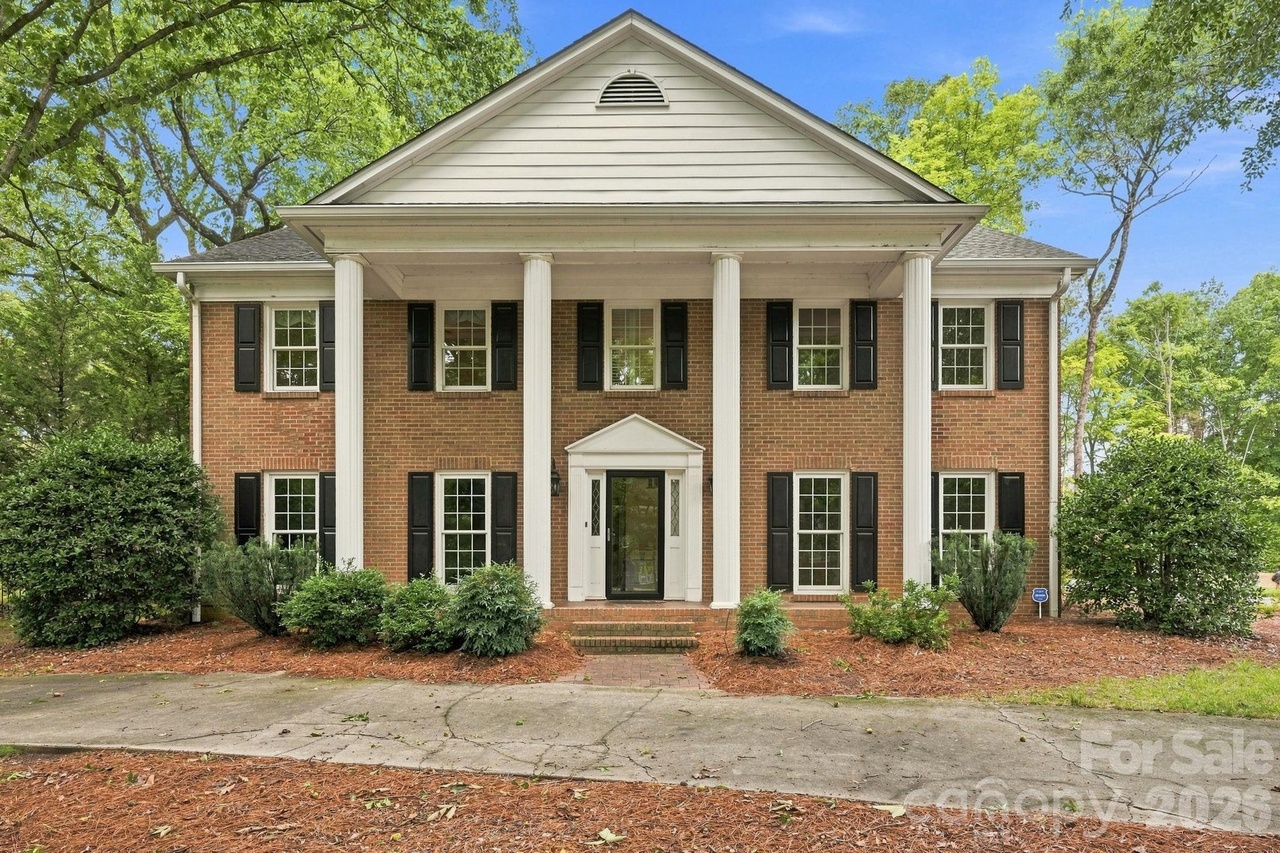 Front exterior of the brick Georgian home at 3528 Broadfield Road